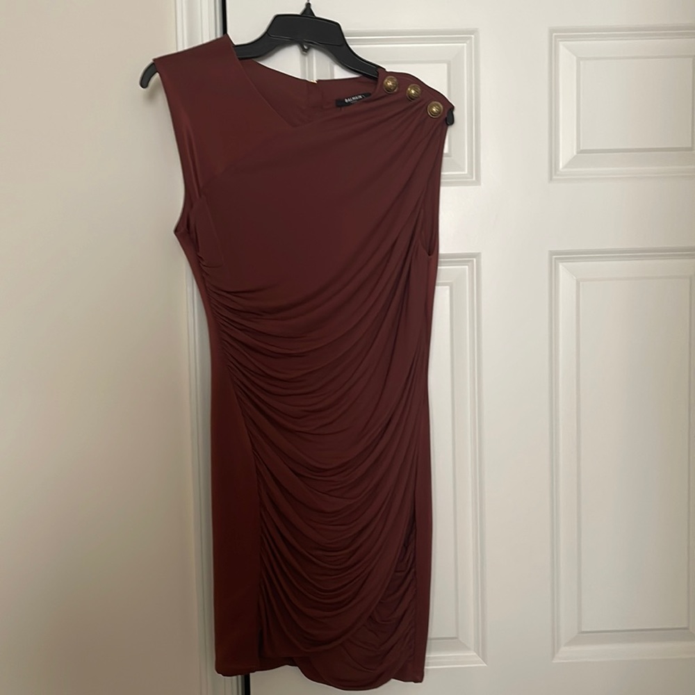 Rustic brown dress from Balmain. Gold-tone embellishments with zip back.
